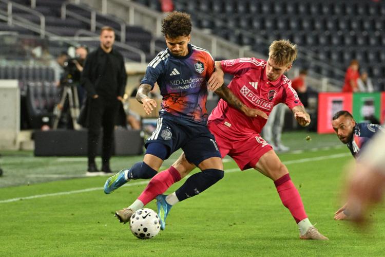 May 19, 2026; �����Ӱ�ԭ��, MO, USA; �����Ӱ�ԭ�� CITY SC midfielder Conrad Wallem (6) gets physical with Houston Dynamo FC forward Lawrence Ennali (11) during the second half of the the US Open Quarterfinals at Energizer Park. Mandatory Credit: Jeff Le-Imagn Images
