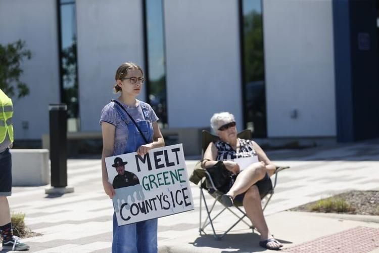 People gathered outside of the Greene County Jail for an Immigrant Justice Collaborative news conference Saturday, April 25, 2026, to call on the Sheriff's Office to let the group tour the facility and visit with inmates.