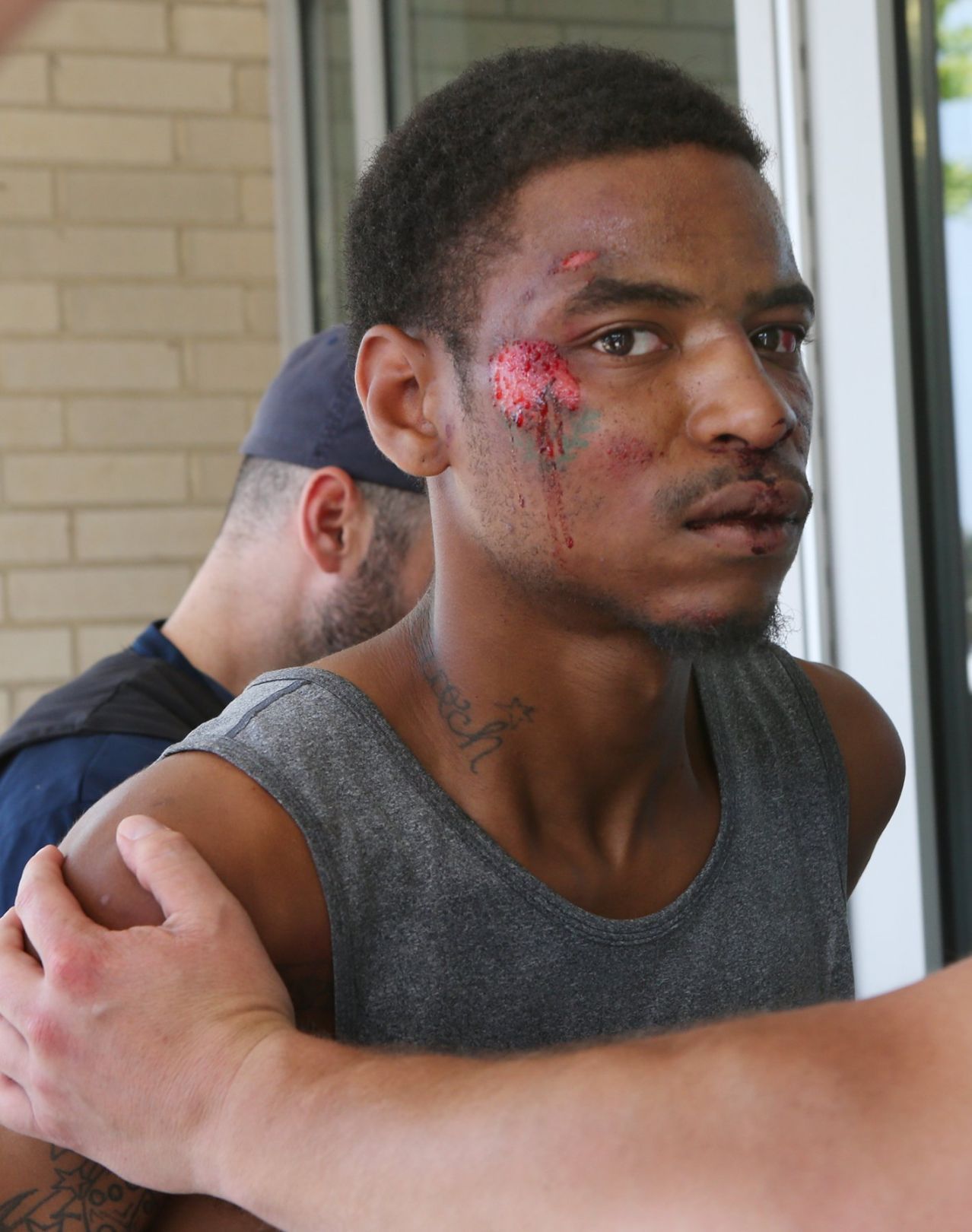 Alleged gunman others in custody in attack on St. Louis police