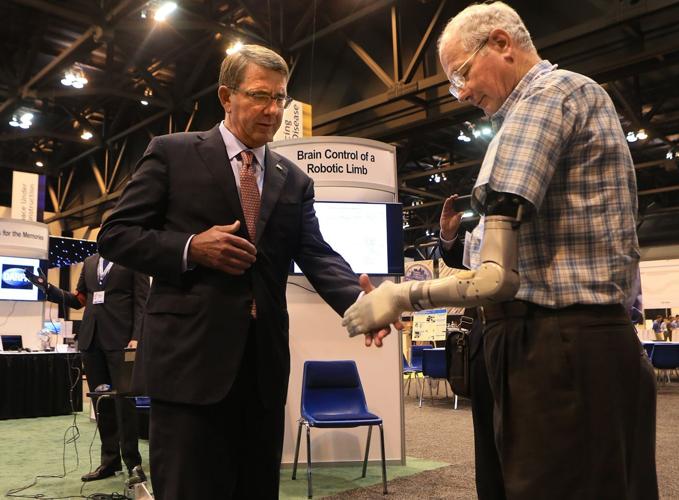 Defense Secretary visits DARPA conference