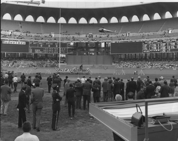 Painters from Warren Sign Company prepare new stcikers on the left field  wall of retired numbers for opening day at Busch Stadium in St. Louis in  April 5, 2013. The St. Louis