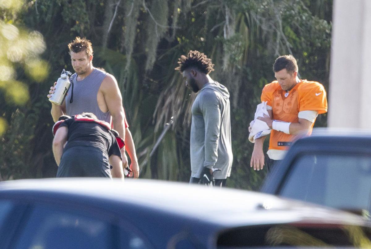 Tampa Bay Buccaneers tight end Rob Gronkowski, left, is seen with wide receiver Chris Godwin, center, and quarterback Tom Brady during a private workout Tuesday, June 23, 2020 at Berkeley Preparatory School in Tampa.