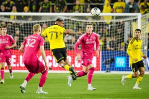 Columbus Crew forward Josef Martinez (77) heads a ball past St. Louis CITY SC defender Timo Baumgartl (32) during the U.S. Open
