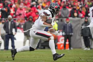 Jan 18, 2025; Kansas City, Missouri, USA; Houston Texans running back Joe Mixon (28) runs the ball against the Kansas City Chiefs during the first half of a 2025 AFC divisional round game at GEHA Field at Arrowhead Stadium. Mandatory Credit: Denny Me