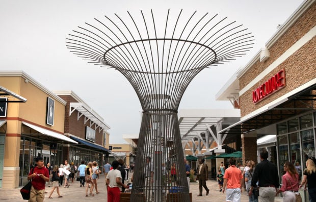 Bargain hunters line up for outlet mall opening