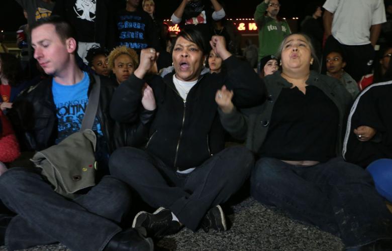 More than 150 demonstrators protest in front of Ferguson Police Station