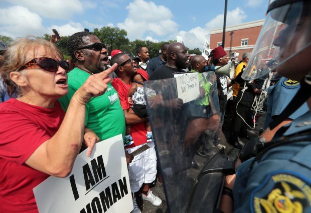 Protesters shout at barricade in Ferguson