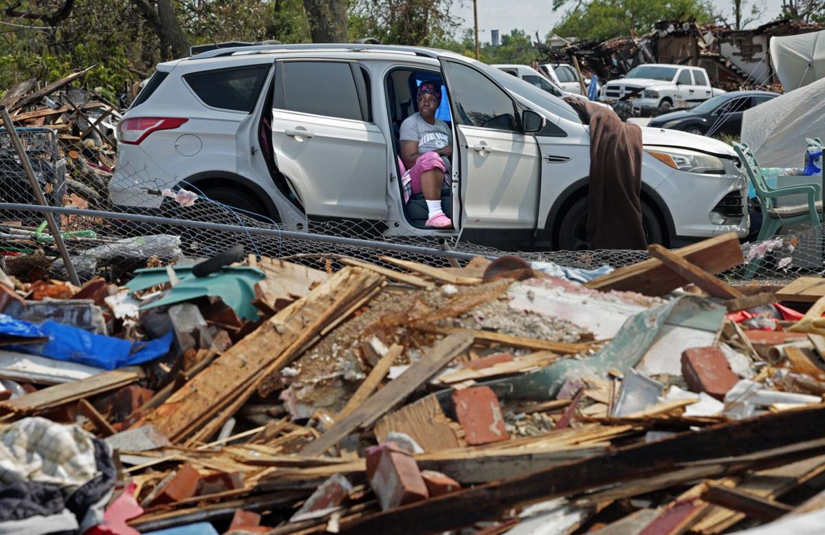 Tornado victims cling to their property, despite the damage