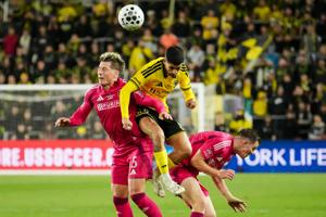 Columbus Crew midfielder Santiago Rodriguez (8) heads a ball over St. Louis CITY SC defender Lukas MacNaughton (5) during the