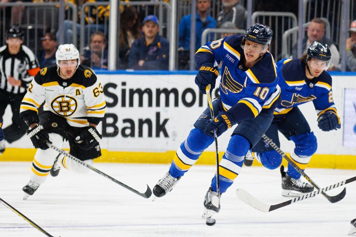 Arizona Coyotes defenseman Josh Brown (3) sends St. Louis Blues right wing  Alexey Toropchenko (13) to the ice as Blues defenseman Marco Scandella (6)  moves in to get the puck during the