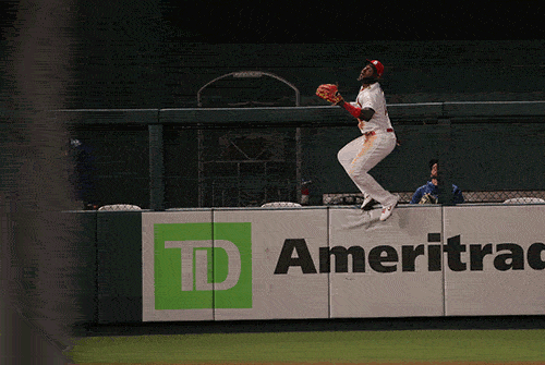 Cardinals' Marcell Ozuna climbs wall but ball never got there