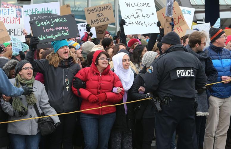 Protesters converge on Lambert over Trump policies