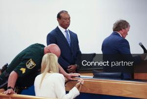 Tiger Woods appears in County Judge Darren Steele's courtroom for a change of plea hearing from an arrest in March, Sept. 2,