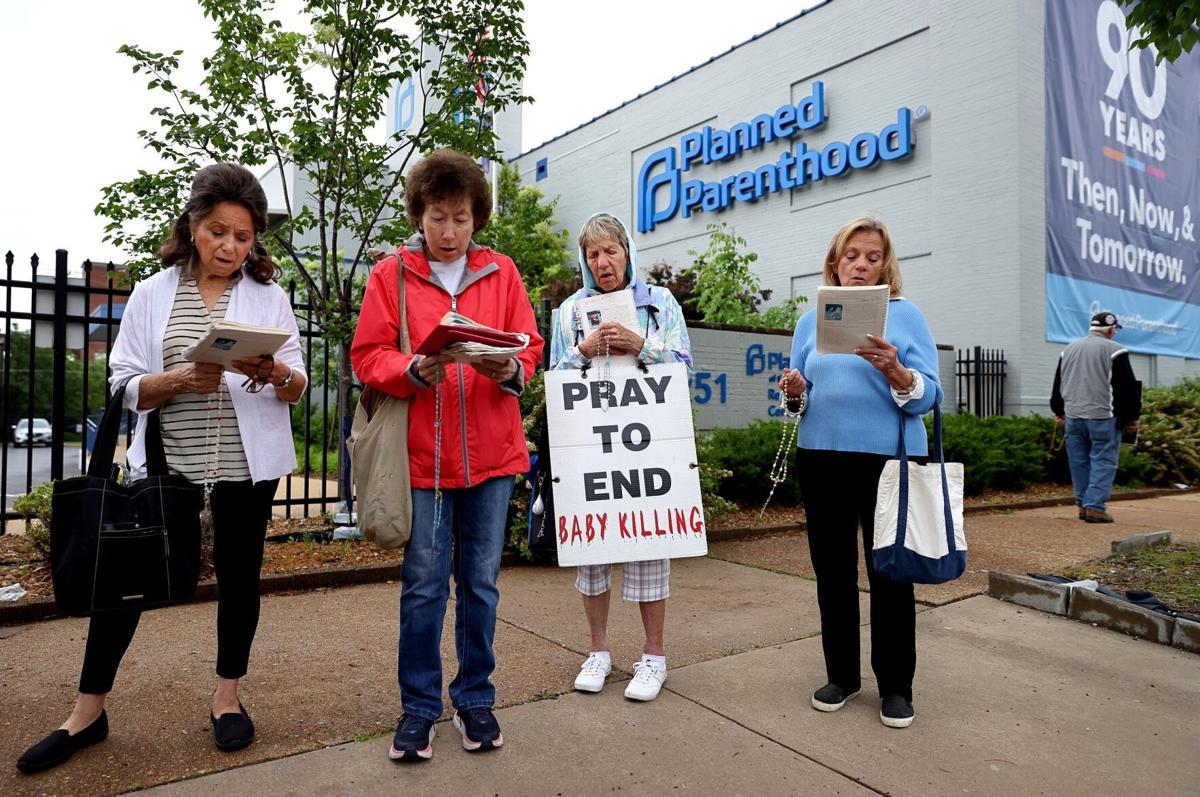 Anti-abortion activists hold weekly prayer vigil