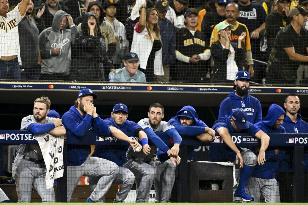 The Los Angeles Dodgers' dugout watches during the ninth inning in Game Four of the National League Division Series against the San Diego Padres at Petco Park on Saturday, Oct. 15, 2022, in San Diego.