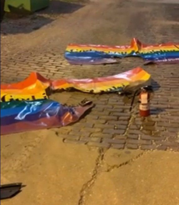 gay pride flag on fire