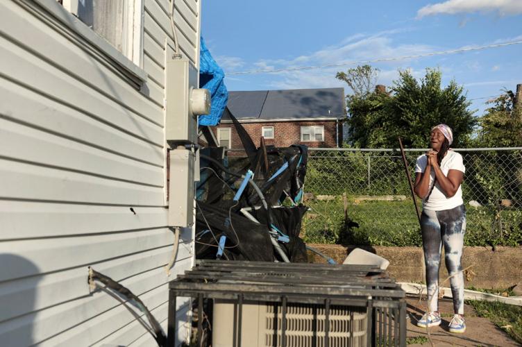 Tornado leaves residents reluctant to separate from damaged property