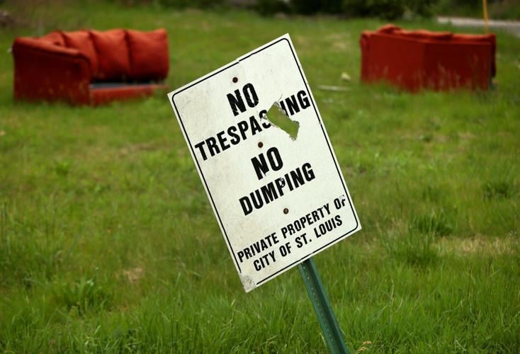 Across Kinloch, illegal dumping leaves trash in roadways and overgrown