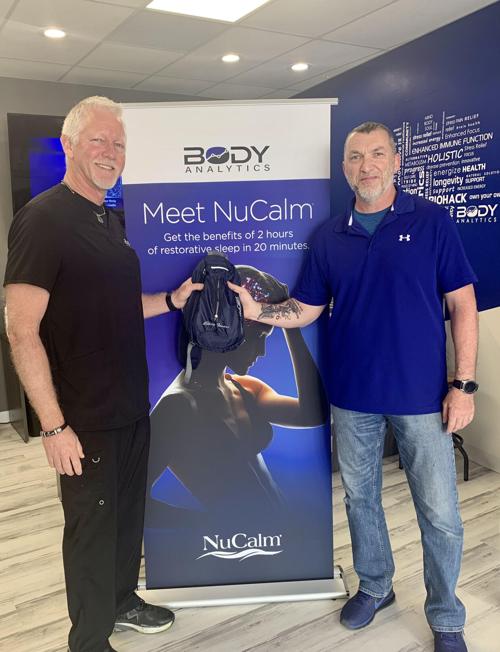 Johnny Harper of Body Analytics in St Louis presents gifted NuCalm stress-relief system to local veteran Sven Hunt