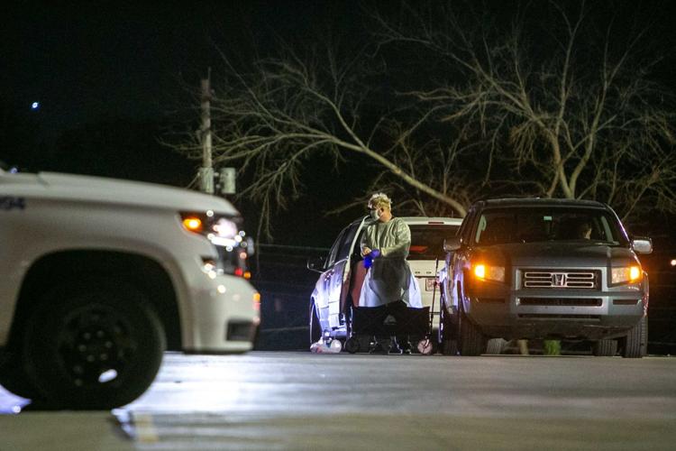 Cars wait at IBEW for COVID tests