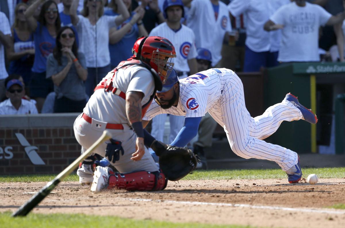 Cardinals whiff, Cubs capitalize in thunderous rout at Wrigley