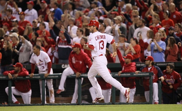 St. Louis Cardinals' Matt Carpenter wears camouflage socks as part of his  Memorial Day uniform as he fouls a ball off his leg while batting during  the first inning of a baseball