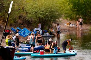 Tubers, rafters and river dwellers alike set their gear on the side of the Salt River in Mesa, Ariz. on Sept. 1, 2025.