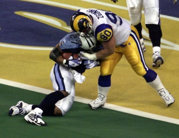 SLP2000012318 - 23 JANUARY 200 - ST. LOUIS, MISSOURI, USA: St. Louis Rams  wide receiver Ricky Proehl runs around the Trans World Dome with the Vince  Lombardi Trophy after defeating the Tampa