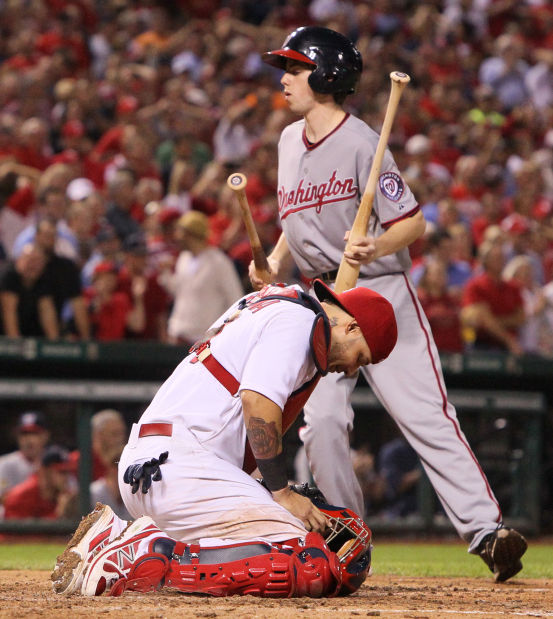 St. Louis Cardinals pitcher Michael Wacha can't make a play on a ball hit  by Washington Nationals Ryan Zimmerman in the ninth inning at Busch Stadium  in St. Louis on September 24