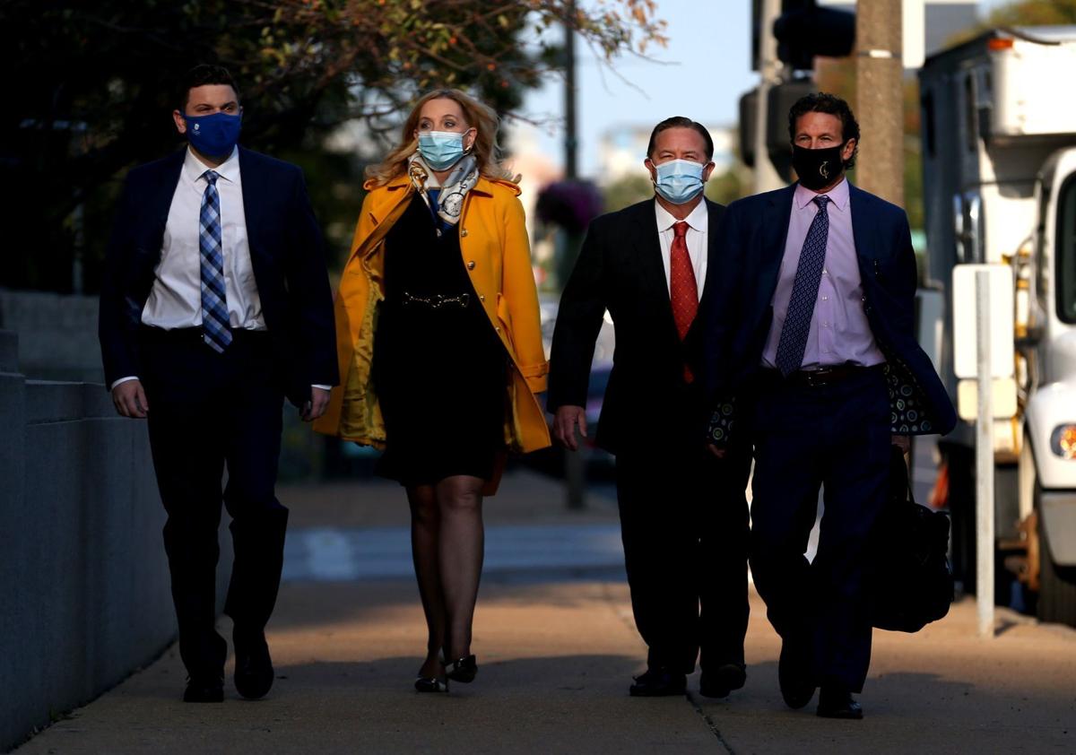 Mark and Patricia McCloskey arrive for court