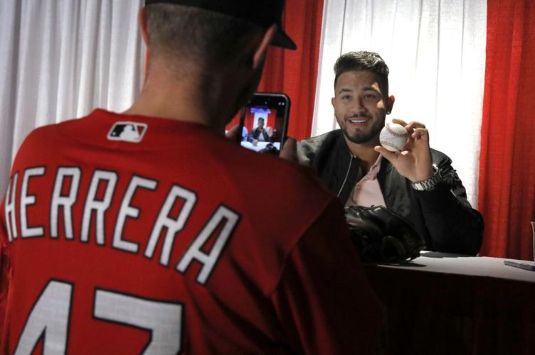 St. Louis Cardinals catcher Iván Herrera signs autographs
