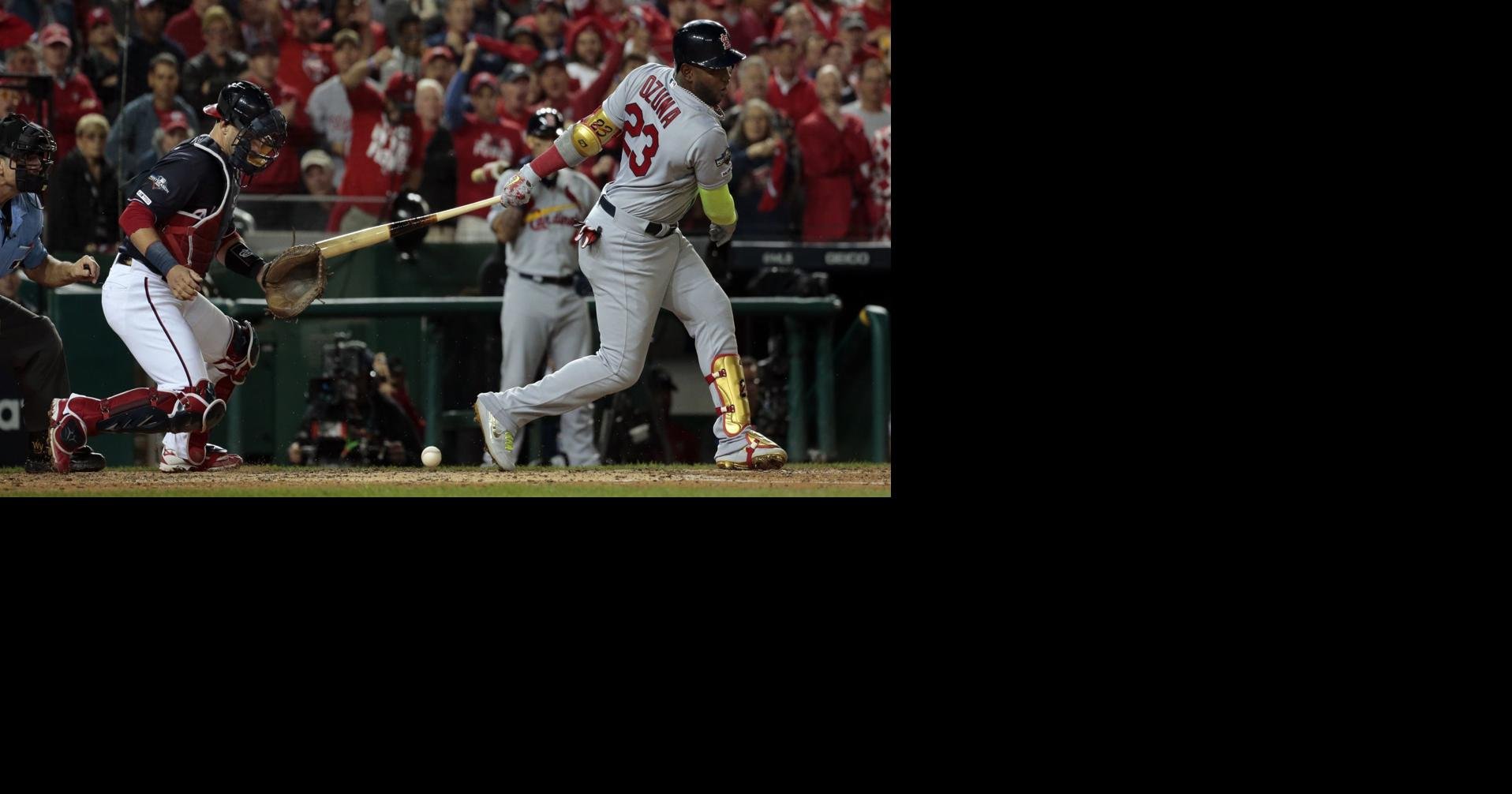 The Washington Nationals Ryan Zimmerman, Anthony Rendon and Trea Turner (7)  celebrate with teammates after beating the St. Louis Cardinals in the  National League Championship Series at Nationals Park in Washington, D.C.