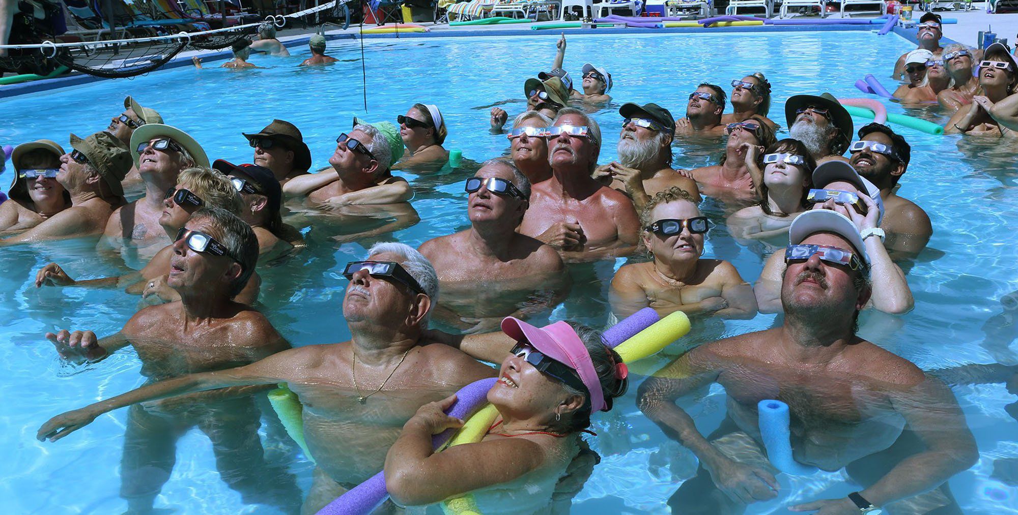 Post-Dispatch photographer walks the path of totality at a Missouri nudist  camp