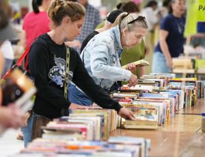 Shoppers look for book bargains during the Great American Book Sale inside the Flo Fabrizio Ice Center in Erie, Pa., on June 14, 2026.