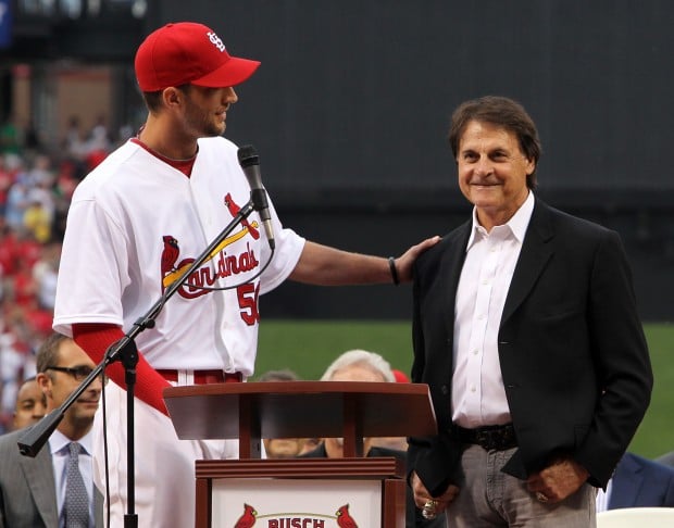 St. Louis Cardinals manager Tony La Russa hugs wife Elaine and