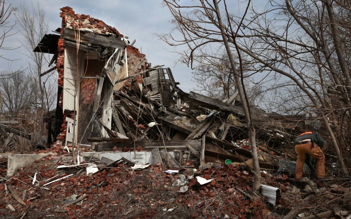 Salvaging what's left of a collapsed flat on Hebert Street
