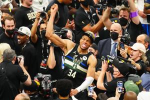 Jul 20, 2021; Milwaukee, Wisconsin, USA;  Milwaukee Bucks forward Giannis Antetokounmpo (34) celebrates after game six of the 2021 NBA Finals against the Phoenix Suns at Fiserv Forum. Mandatory Credit: Mark J. Rebilas-USA TODAY Sports