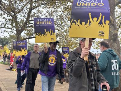 Janitors rally in front of Anheuser-Busch's Soulard brewery