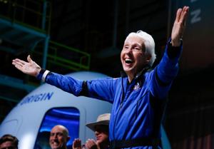 Wally Funk reacts after receiving her astronaut's wings from Blue Origin's Jeff Ashby, a former space shuttle commander at a post-launch press conference, in the nearby town of Van Horn