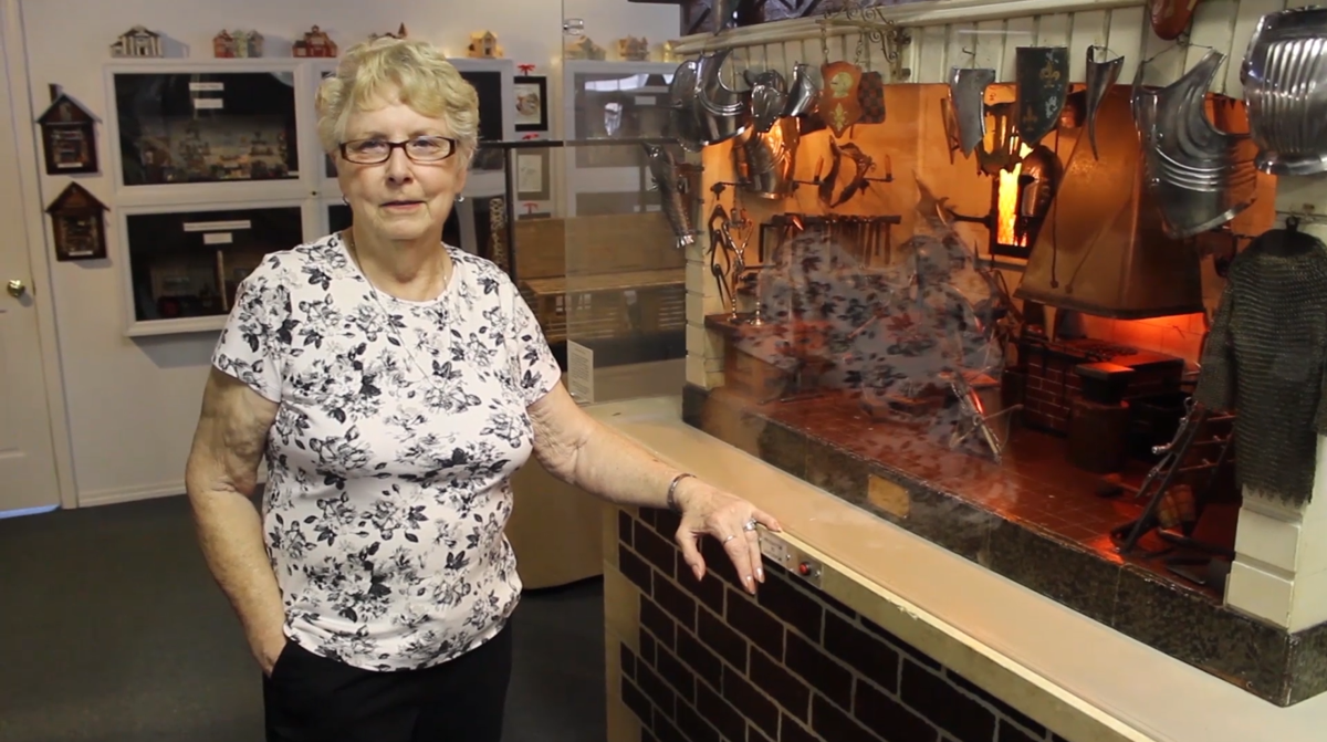 Joanne Martin standing next to The Armory