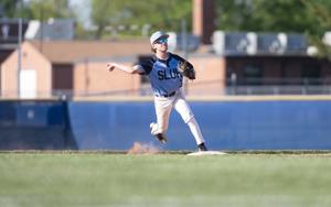 Reporter Steve Overbey talks with SLUH senior Logan Studer after a SLUH victory over Freeburg