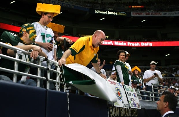 Green Bay Packers fans, wearing their cheeseheads, packed the Edward Jones  Dome in St. Louis to watch the Packers take on the St. Louis Rams on  September 27, 2009. Green Bay won