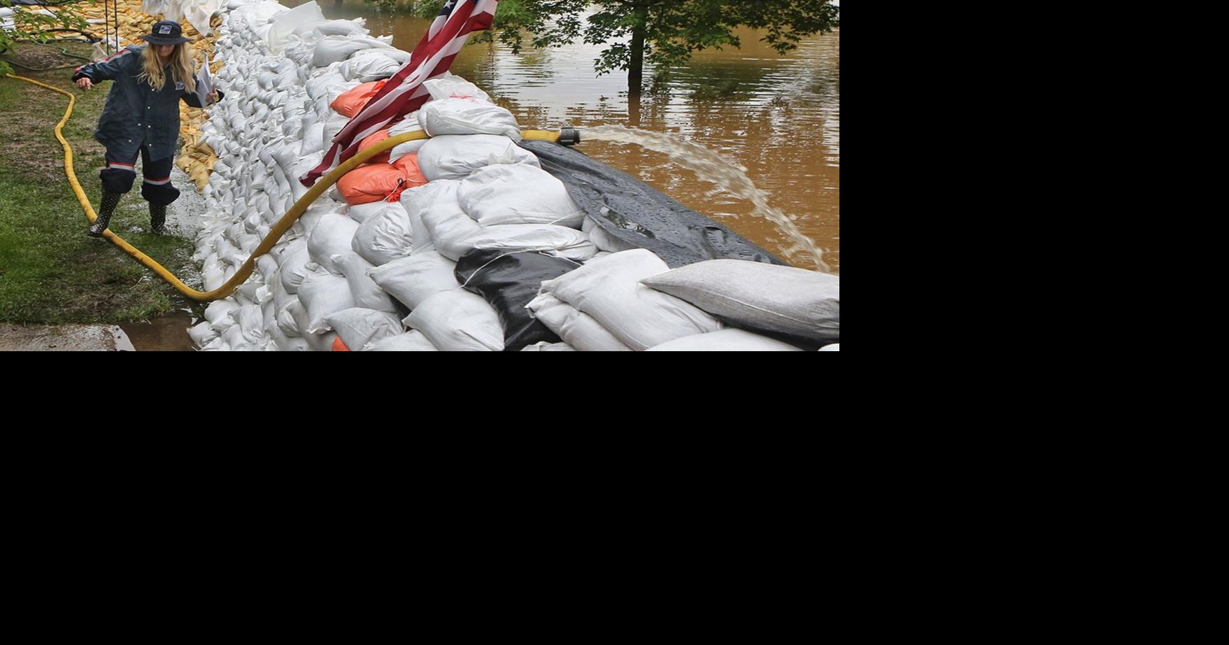 Wednesday's photos: More rain, but floodwaters start to recede from ...