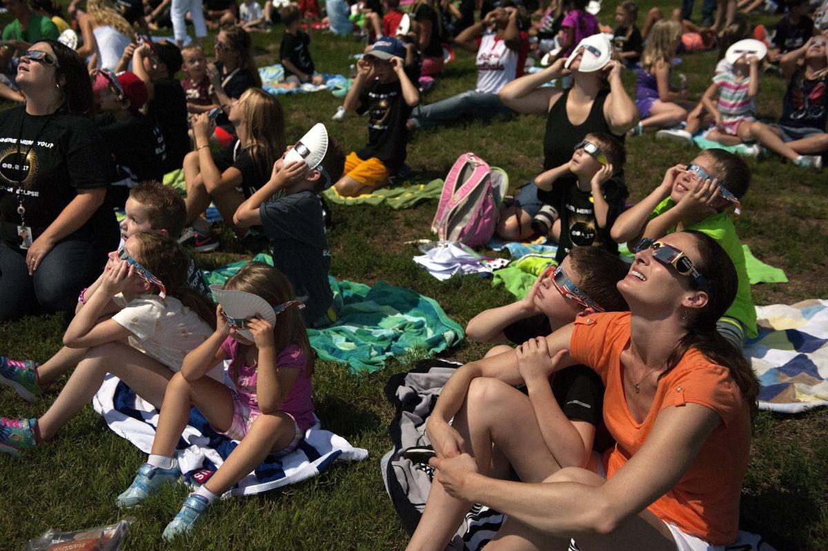 Post-Dispatch photographer walks the path of totality at a Missouri nudist  camp