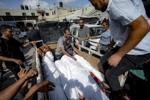 Attack kills at least 90 Palestinians. Israel says it targeted Hamas military commander.