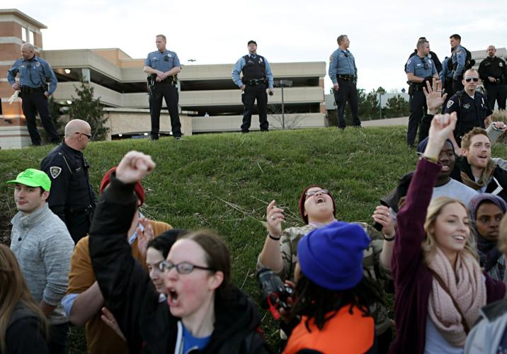 Protesters march around West County Center and on Manchester Road