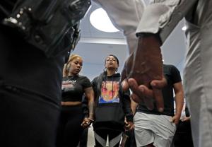 Ferguson police arrest three in bystander mother’s shooting death