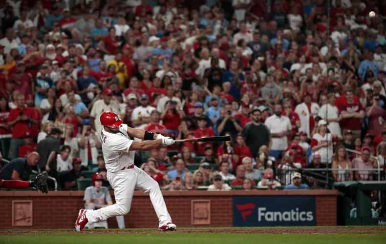 Pujols launches number 698