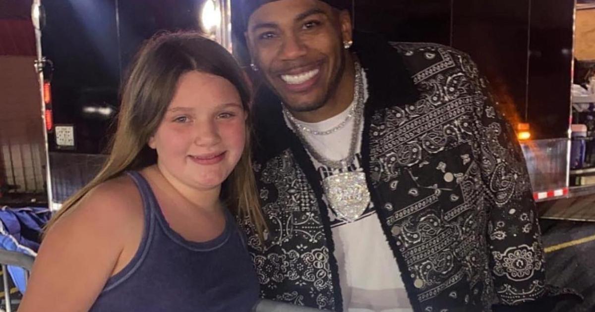 Nelly gives his jacket to a 12-yo fan after show