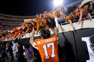 Oklahoma State Cowboys quarterback Drew Mestemaker (17) celebrates with fans after a college football game between the Oklahoma